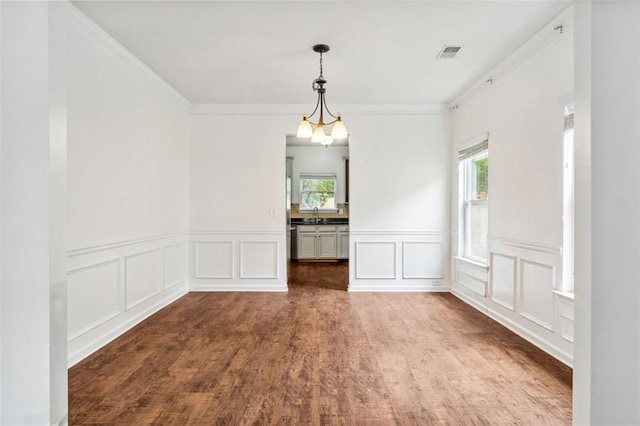 4515 Ambassador Way, Cumming, GA 30040 - unfurnished dining area featuring a decorative wall, a wainscoted wall, wood finished floors, ornamental molding, and a sink