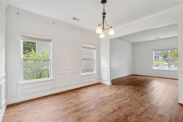 4515 Ambassador Way, Cumming, GA 30040 - spare room featuring wood finished floors, wainscoting, and a decorative wall