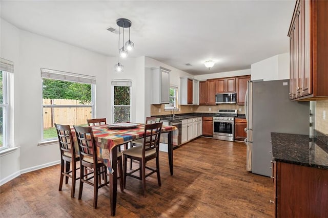 4515 Ambassador Way, Cumming, GA 30040 - dining area featuring dark wood-style flooring and baseboards