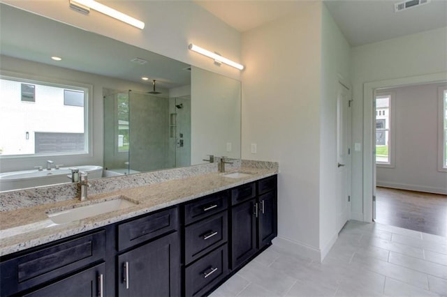 3065 Reserve Ct SW, Conyers, GA 30094 - full bathroom featuring a shower stall, a bath, tile patterned floors, baseboards, and double vanity