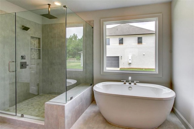 3065 Reserve Ct SW, Conyers, GA 30094 - bathroom with a freestanding bath, a stall shower, and baseboards