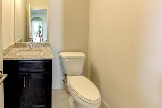 3065 Reserve Ct SW, Conyers, GA 30094 - bathroom with vanity, toilet, baseboards, and tile patterned floors