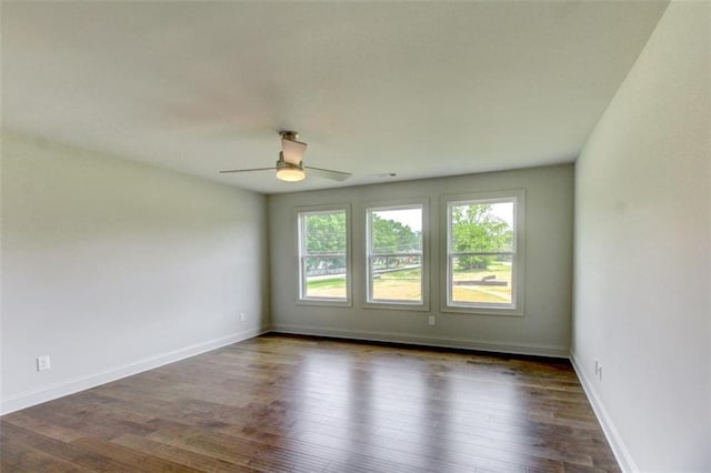 3065 Reserve Ct SW, Conyers, GA 30094 - empty room featuring ceiling fan, wood finished floors, and baseboards