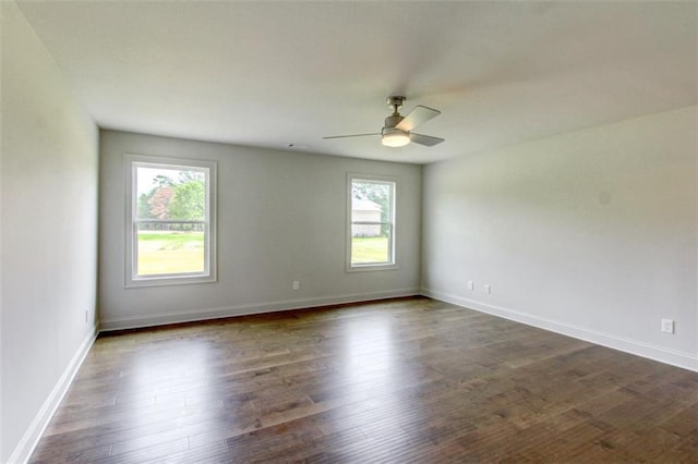 3065 Reserve Ct SW, Conyers, GA 30094 - unfurnished room with plenty of natural light, ceiling fan, dark wood finished floors, and baseboards