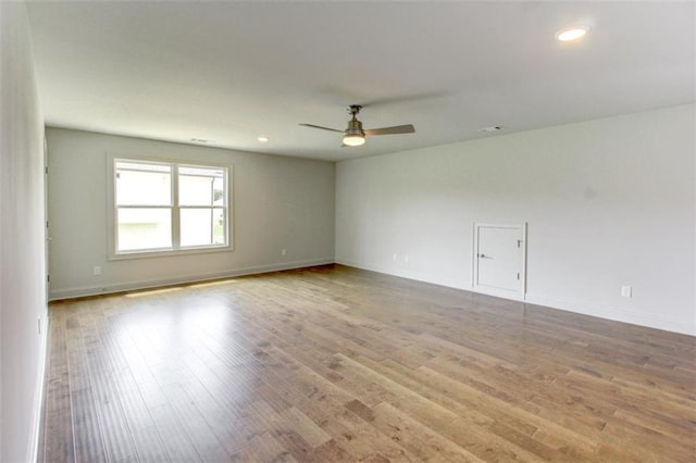 3065 Reserve Ct SW, Conyers, GA 30094 - spare room featuring a ceiling fan, wood finished floors, recessed lighting, and baseboards