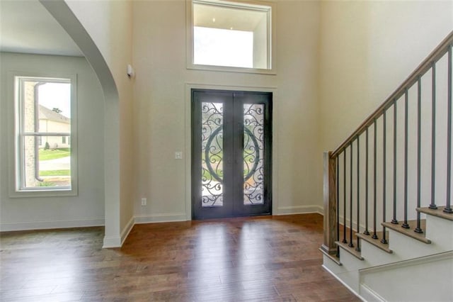 3065 Reserve Ct SW, Conyers, GA 30094 - foyer featuring arched walkways, french doors, stairs, and a high ceiling