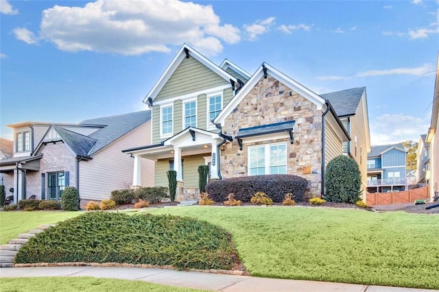 craftsman-style house featuring a front yard