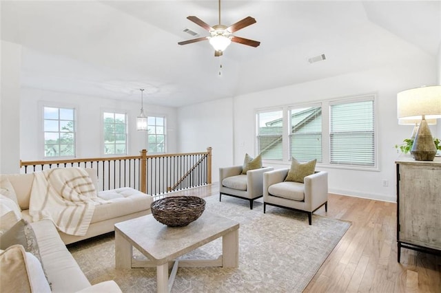 living room featuring light hardwood / wood-style floors and ceiling fan