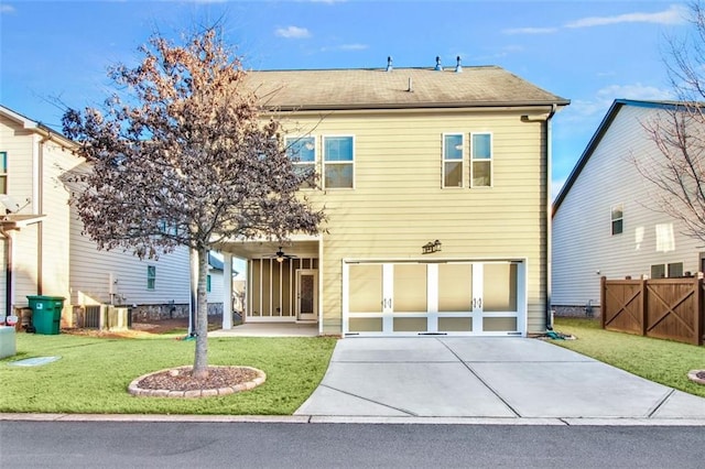 view of front of house with a front yard and a garage