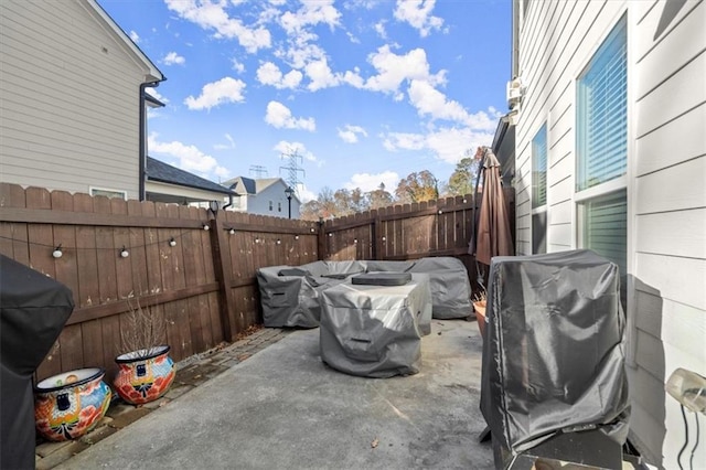 view of patio with a fenced backyard and grilling area