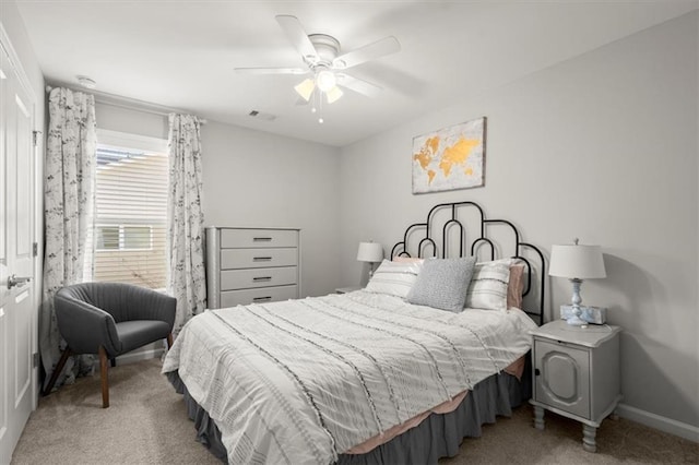 bedroom with carpet, visible vents, ceiling fan, and baseboards