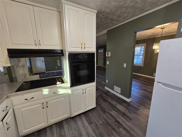 kitchen with white cabinetry, ornamental molding, and black appliances