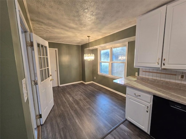 kitchen with dark hardwood / wood-style flooring, hanging light fixtures, and white cabinets