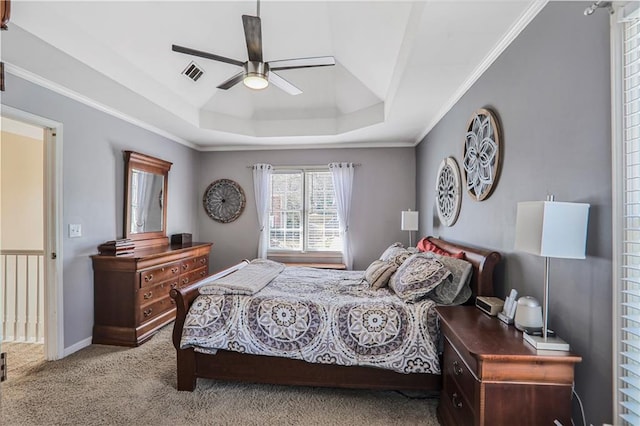 bedroom featuring visible vents, ornamental molding, carpet flooring, a raised ceiling, and ceiling fan