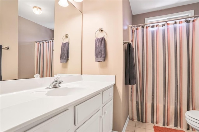 full bathroom with vanity, tile patterned floors, and toilet