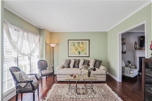 living room with baseboards, a fireplace, dark wood-style flooring, and ornamental molding