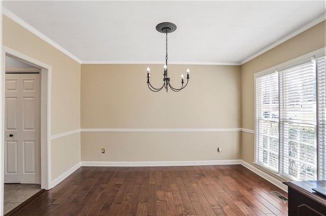 unfurnished dining area featuring visible vents, plenty of natural light, an inviting chandelier, and dark wood finished floors