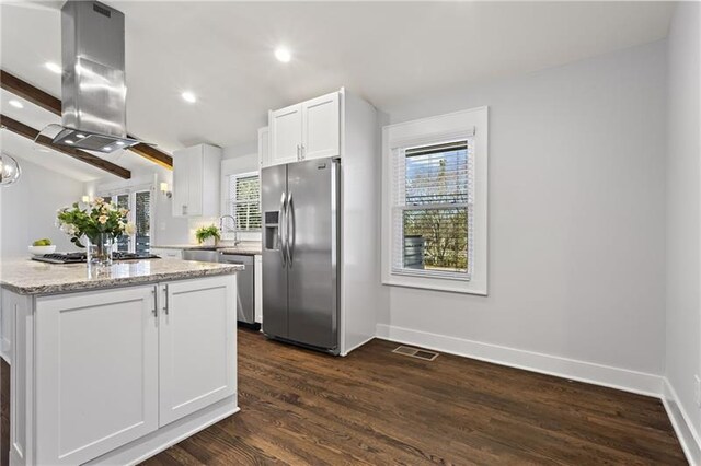 4178 Castle Pines Ct, Tucker, GA 30084 - kitchen featuring appliances with stainless steel finishes, island exhaust hood, white cabinetry, baseboards, and recessed lighting