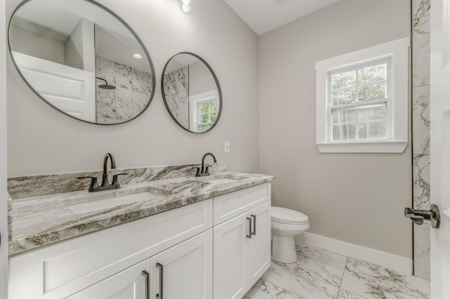 961 Goat Rd NW, Resaca, GA 30735 - full bath with marble finish flooring, double vanity, healthy amount of natural light, and toilet