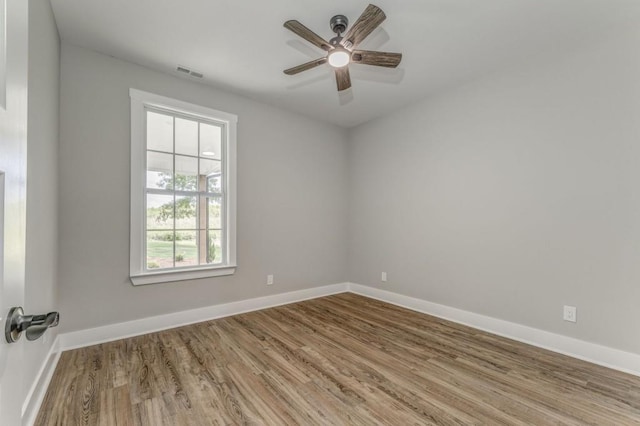 961 Goat Rd NW, Resaca, GA 30735 - spare room featuring wood finished floors, a ceiling fan, and baseboards