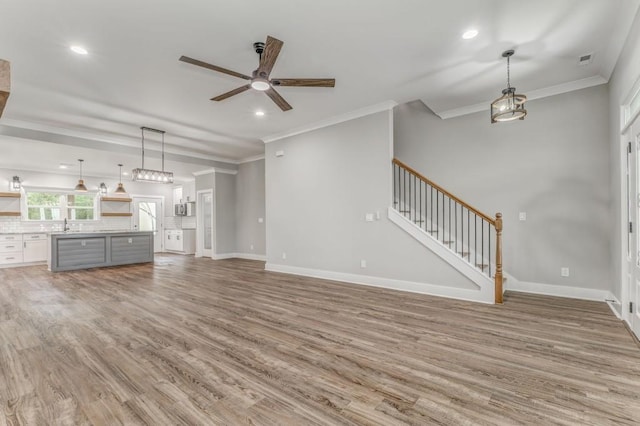 961 Goat Rd NW, Resaca, GA 30735 - unfurnished living room featuring a ceiling fan, light wood-style floors, stairs, baseboards, and recessed lighting