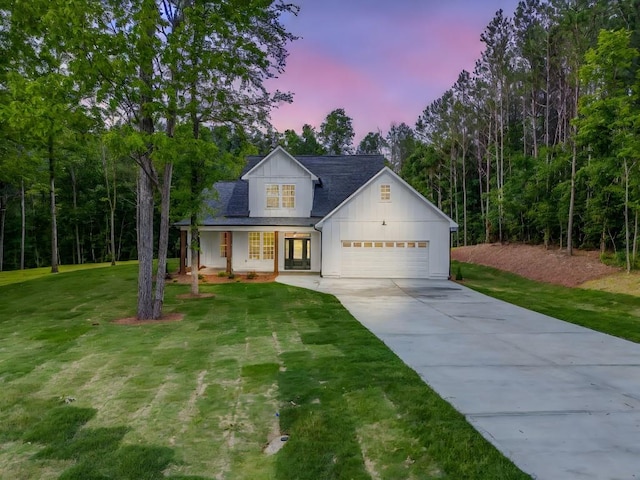 961 Goat Rd NW, Resaca, GA 30735 - modern inspired farmhouse with board and batten siding, french doors, driveway, a lawn, and an attached garage