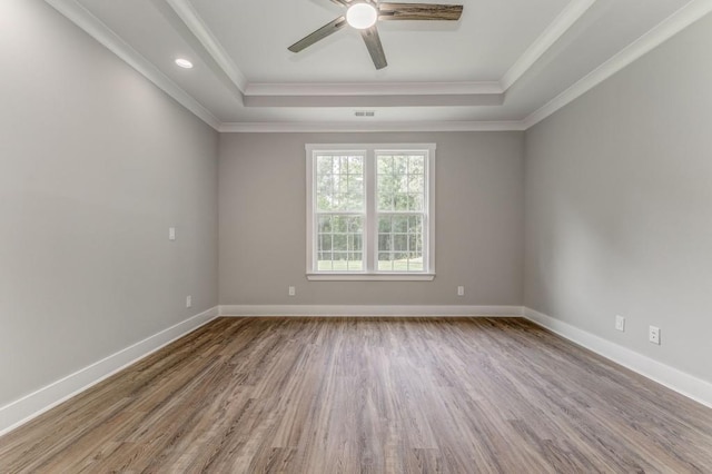 961 Goat Rd NW, Resaca, GA 30735 - empty room with a raised ceiling, wood finished floors, ceiling fan, ornamental molding, and baseboards