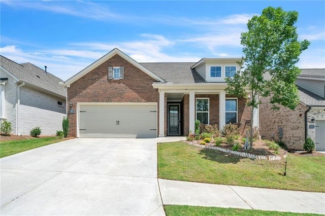 view of front of home featuring driveway, an attached garage, a front lawn, and brick siding