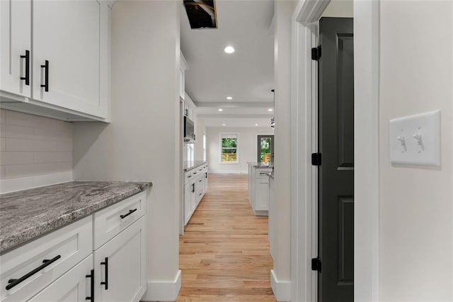 hallway featuring light wood-type flooring