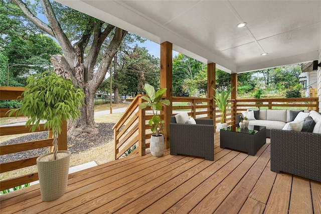 wooden deck featuring an outdoor living space