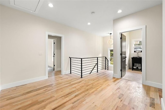 spare room with light hardwood / wood-style floors