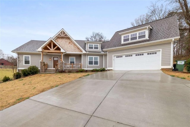 view of front facade with a shingled roof, concrete driveway, covered porch, an attached garage, and a front lawn