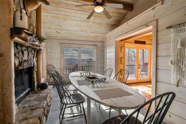 dining area with french doors, plenty of natural light, lofted ceiling, and ceiling fan