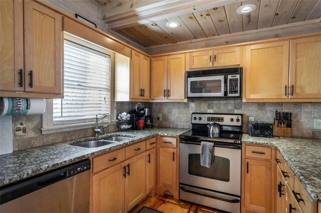 kitchen featuring appliances with stainless steel finishes, wood ceiling, sink, stone counters, and light hardwood / wood-style floors