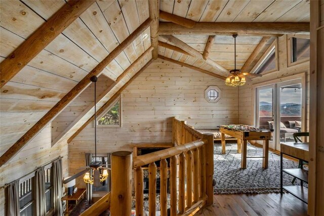 interior space with plenty of natural light, wood ceiling, and hardwood / wood-style flooring