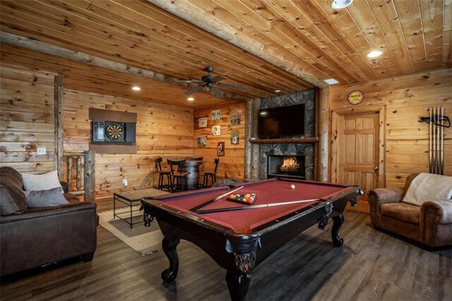 game room with a stone fireplace, billiards, wood ceiling, and hardwood / wood-style flooring