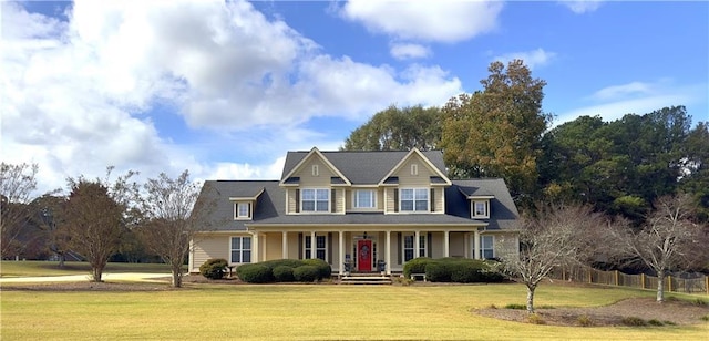 view of front of house with covered porch and a front lawn