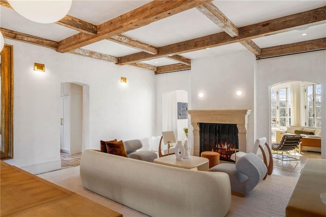 living room with beamed ceiling and coffered ceiling