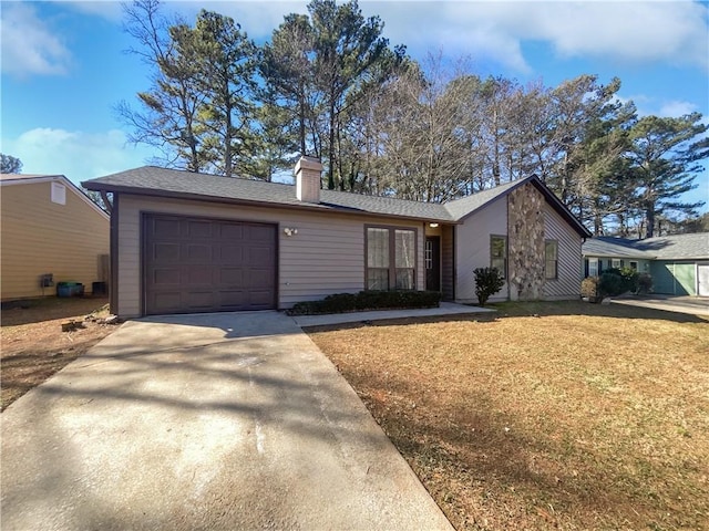 view of front of home featuring a garage, concrete driveway, a chimney, and a front lawn