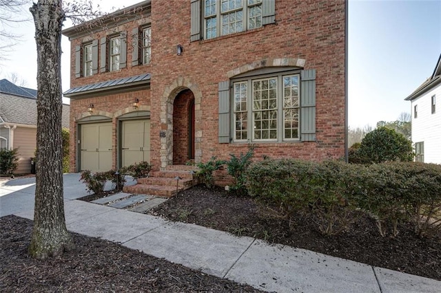 view of front of home featuring brick siding