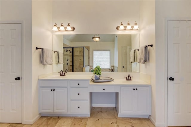 bathroom featuring an enclosed shower, dual vanity, and tile floors