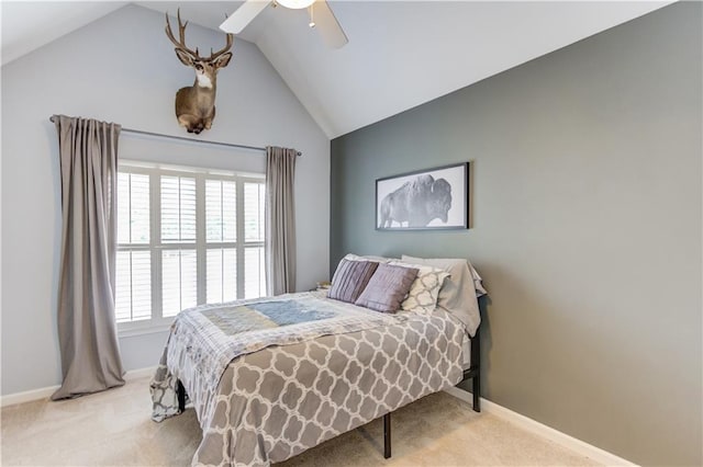 bedroom featuring light carpet, vaulted ceiling, and ceiling fan