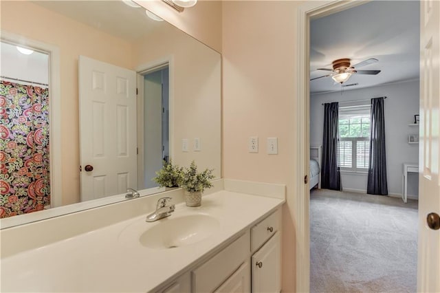 bathroom featuring ceiling fan and large vanity