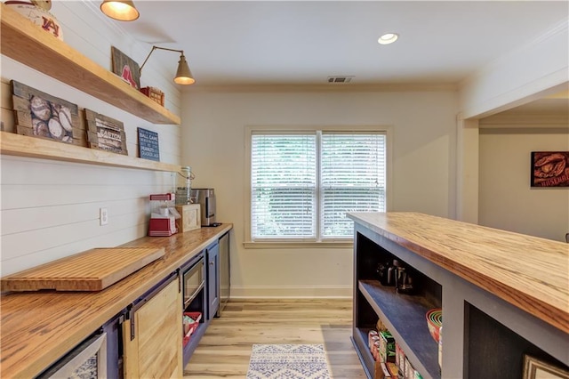 interior space with butcher block counters and light wood-type flooring