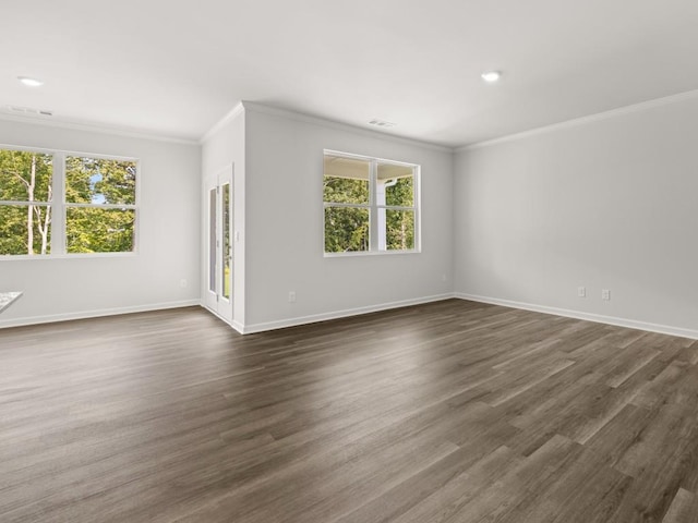 empty room with ornamental molding, baseboards, dark wood-style flooring, and recessed lighting