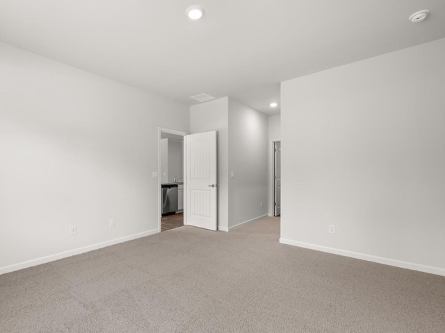 unfurnished room with carpet flooring, baseboards, recessed lighting, and a smoke detector