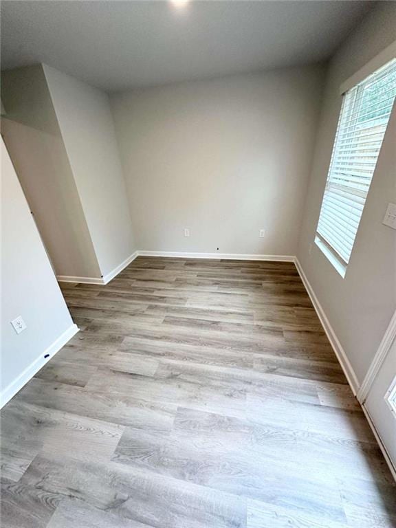 empty room with light hardwood / wood-style floors