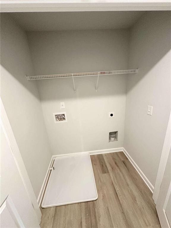 laundry area with light wood-type flooring, washer hookup, and electric dryer hookup