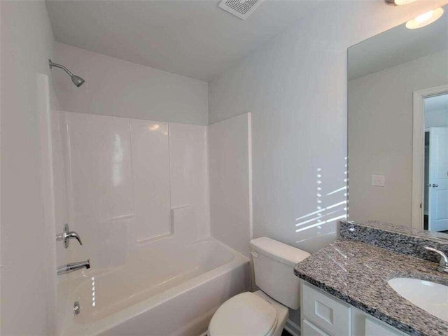 full bathroom featuring toilet, bathing tub / shower combination, and vanity