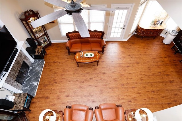 4000 Longlake Dr, Duluth, GA 30097 - living area with wood finished floors, a fireplace, baseboards, and a ceiling fan